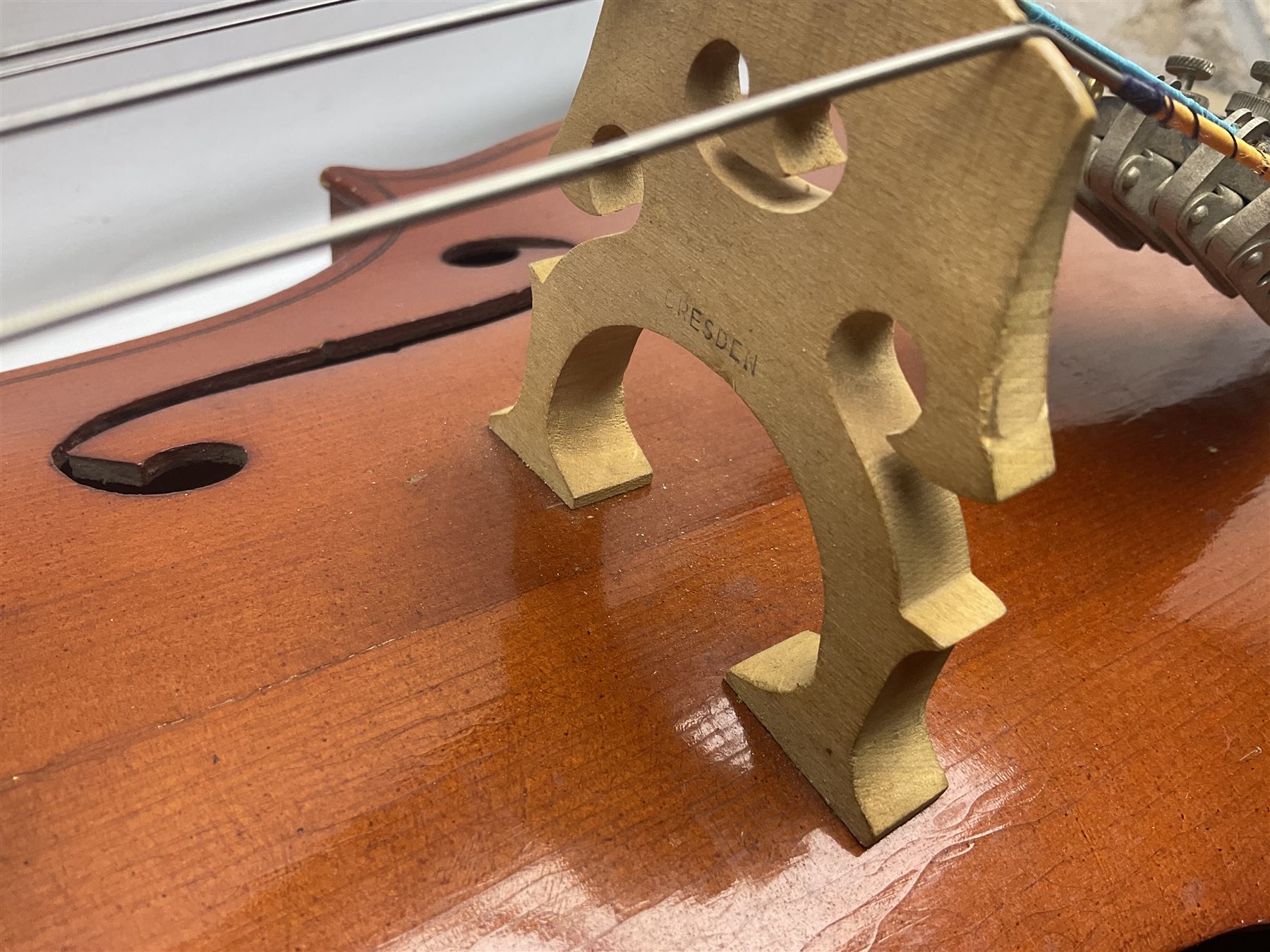 German half-size cello with 69cm two-piece maple back and ribs and spruce top; L112.5cm overall; in soft carrying case with two bows