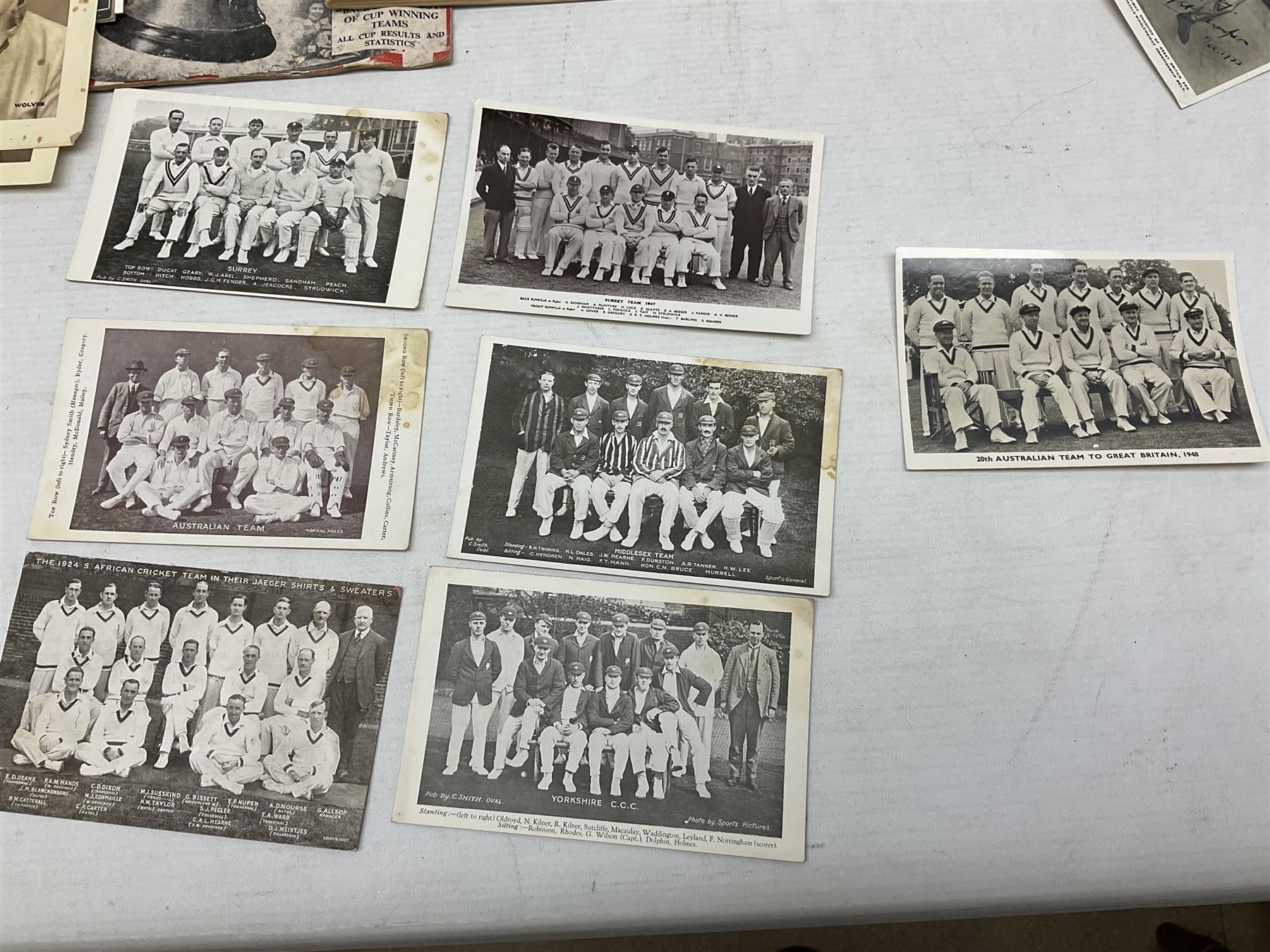 Football - Sherman's Searchlight on Famous Teams trade cards 1938-39 (28) and Searchlight on Famous Players (15); and nine booklets including F.A. Cup Annual 1951;two early 1960s F.A. Yearbooks etc; together with seven photographs of cricket teams, first half of 20th century; and four 1940s and later cricket booklets; and a signed postcard of boxer Len Harvey
