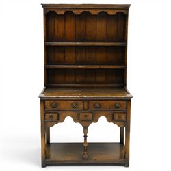 Georgian design oak dresser of small proportions, moulded cornice over open plate rack wit...
