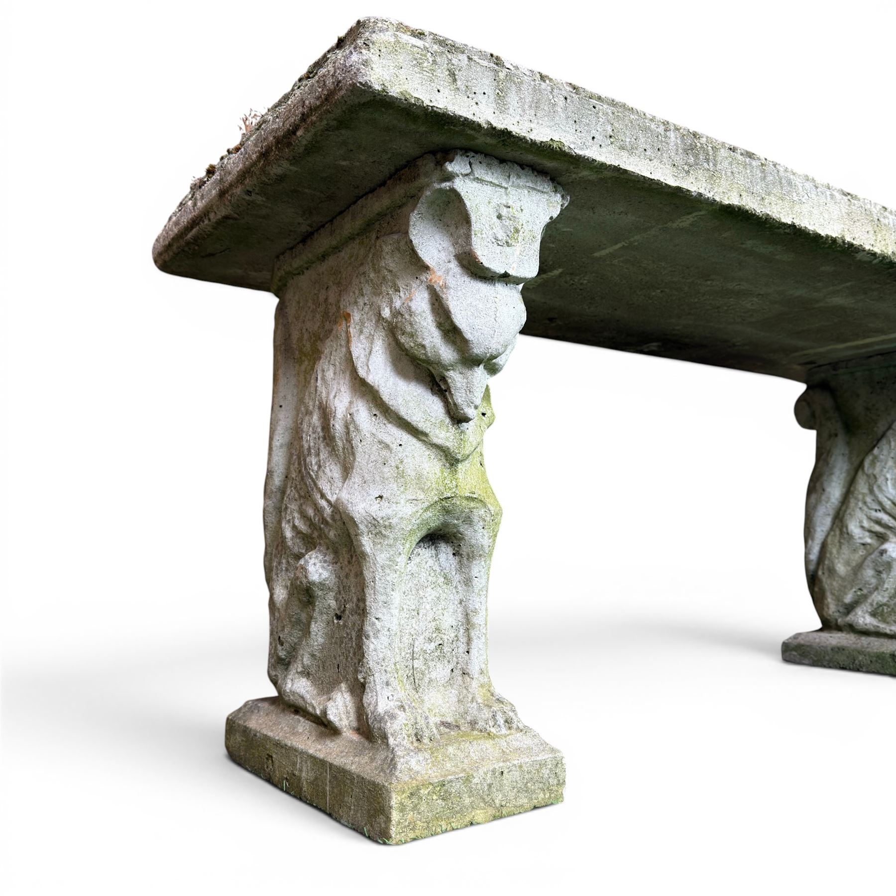 Weathered cast stone three piece garden bench, slab top raised on mythical creature supports