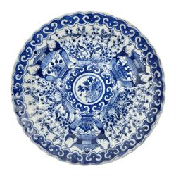 18th century Chinese blue and white Kangxi dish, decorated in the Long Eliza pattern, within a lappet border, four character Kangxi mark beneath, D13cm