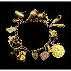 9ct gold link bracelet with 1903 gold full sovereign, 22ct wedding band, 18ct gold two stone diamond ring, 14ct gold star and fourteen 9ct gold charms including fish, mouse, money box, clogs and cat, all hallmarked, stamped or tested