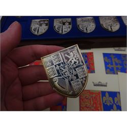 Yorkshire Mint, The Royal Arms Collection, twelve shield shaped silver medallions each depicting variations on the Royal coat of arms, each hallmarked Yorkshire Mint, Birmingham 1976/77, contained within fitted wooden case with associated information cards