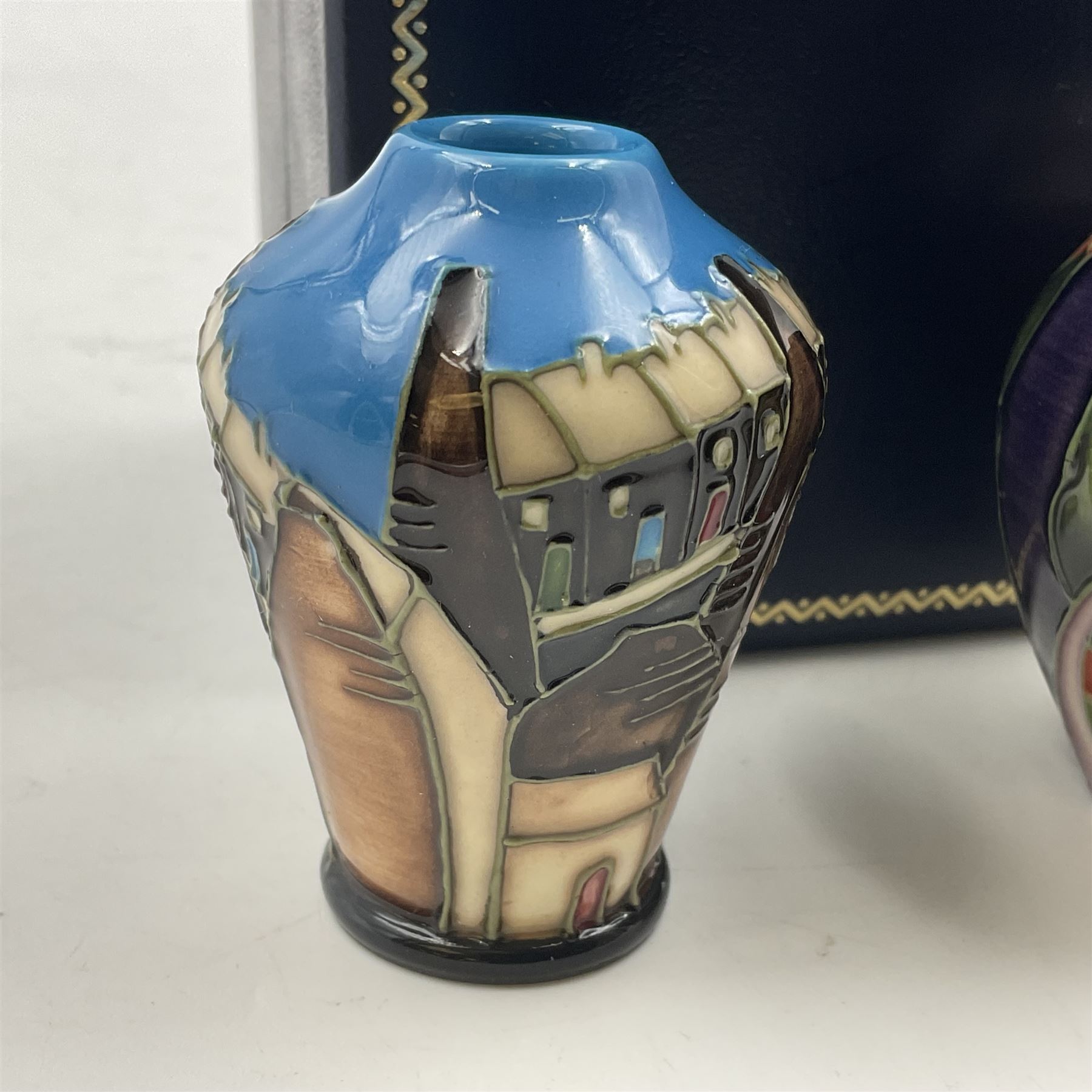 Two miniature Moorcroft vases, one decorated in the Lodge Hill pattern, circa 2007, H6cm,  and the other decorated in Made in Burslem circa 2011, H6cm  