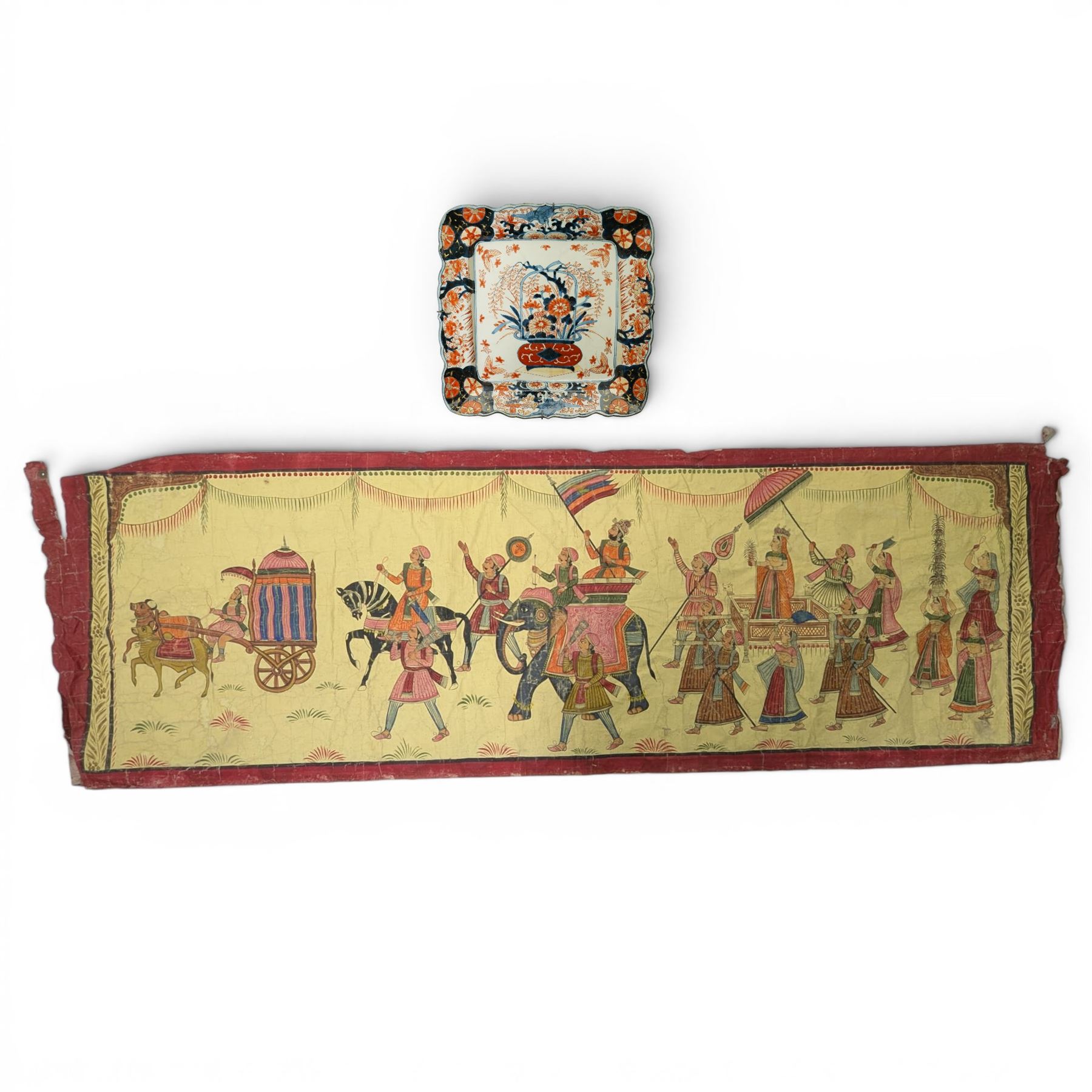 Late 19th/early 20th century Japanese Imari square dish decorated with flowers 32cm and an Indian linen wall hanging decorated with elephants, carriages etc in procession 56cm x 170cm