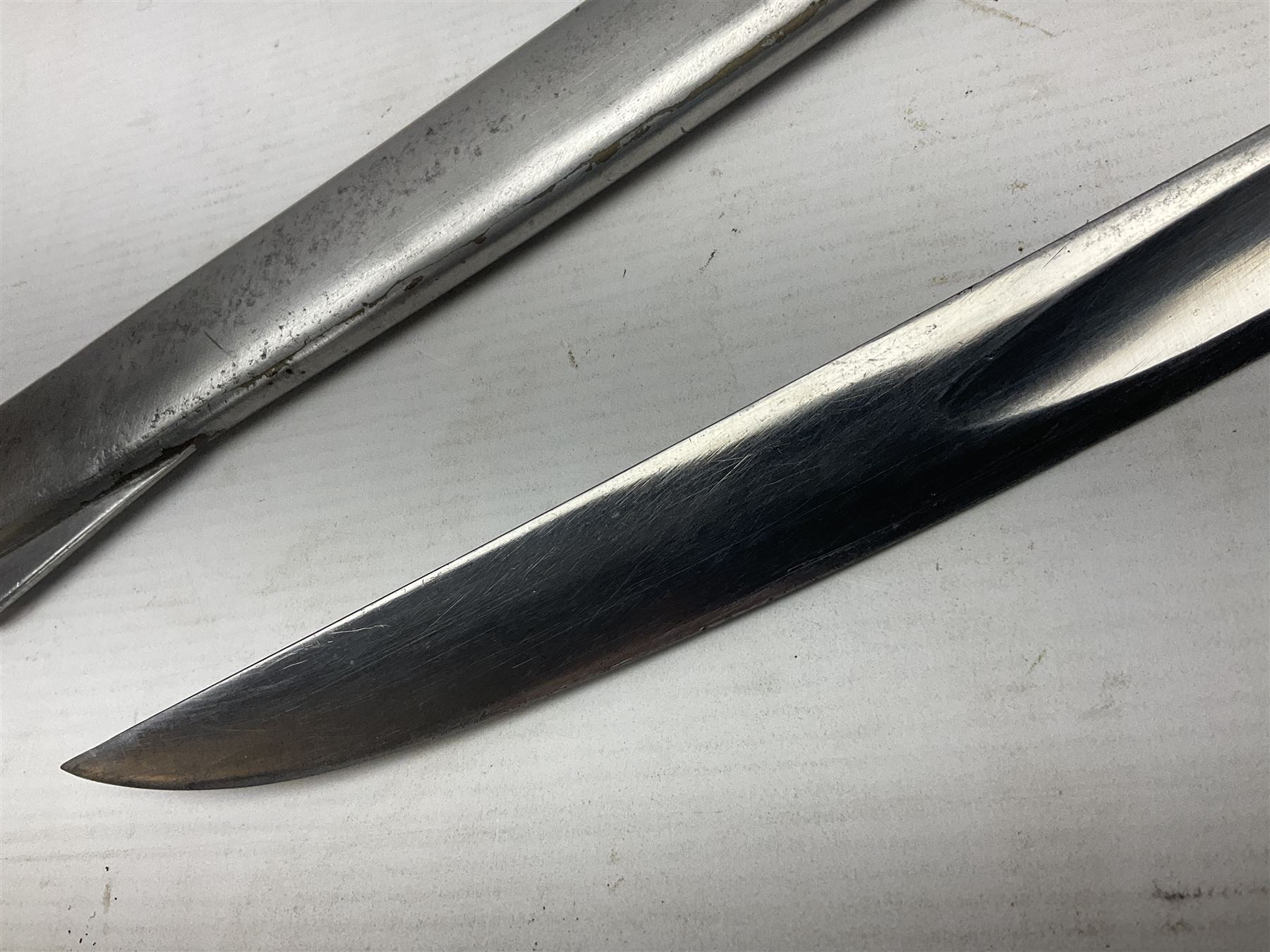 Early 19th century French Lancers officer's sword c1810, the 84cm curving fullered blade retaining most of its bluing, gilding and engraved decoration, inscribed I.S.& C. to ricasso (for Schimelbusch), brass three-bar hilt with elongated elliptical langets and wire-bound leather grip; in polished steel scabbard with two brass suspension rings L100cm overall