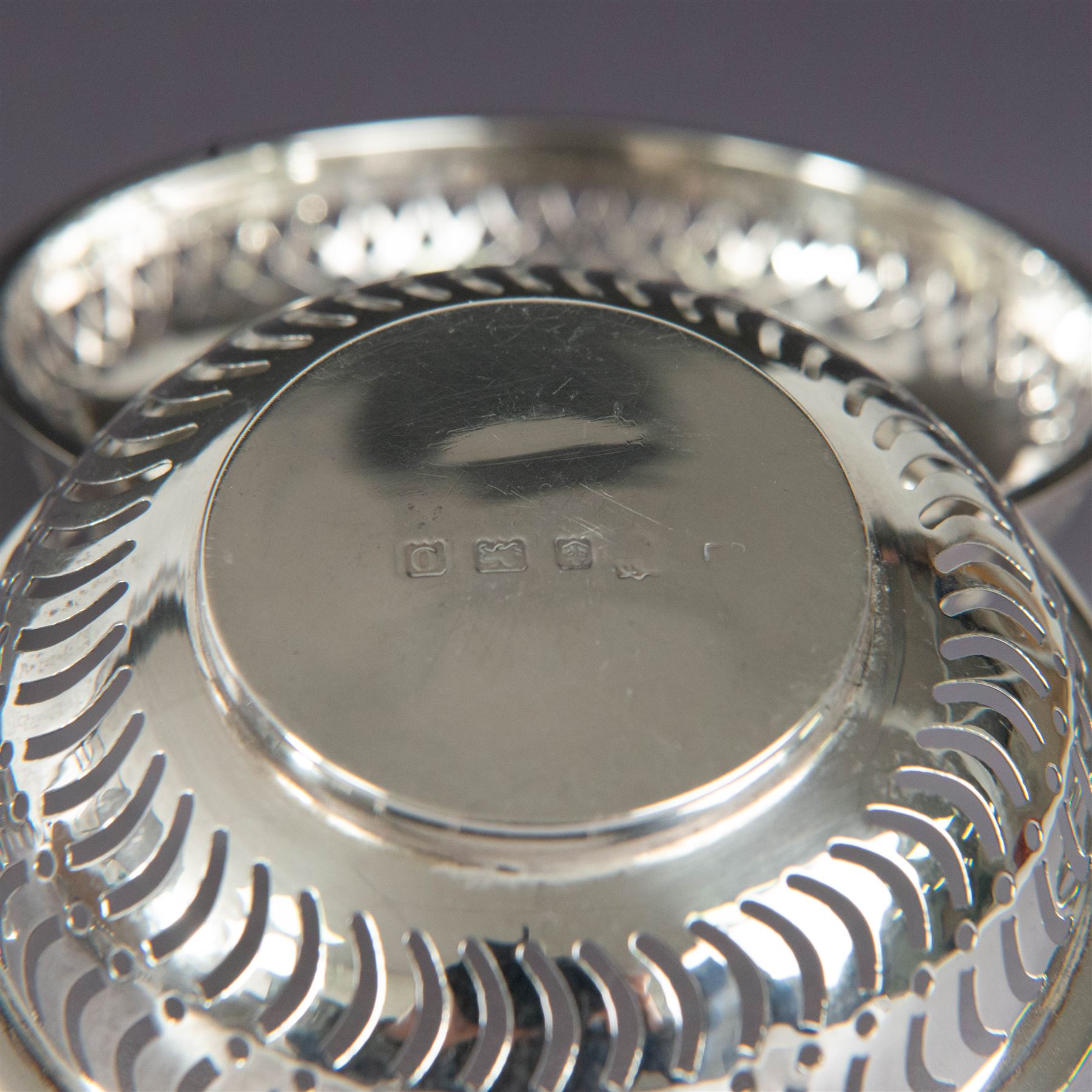 Two pairs of Victorian silver bon bon dishes, modelled as quaiches with pierced sides and twin handles, the larger pair hallmarked Synyer & Beddoes, Birmingham 1913 or 1938, the smaller pair hallmarked Birmingham 1913 or 1938, maker's marks worn and indistinct, largest D9cm