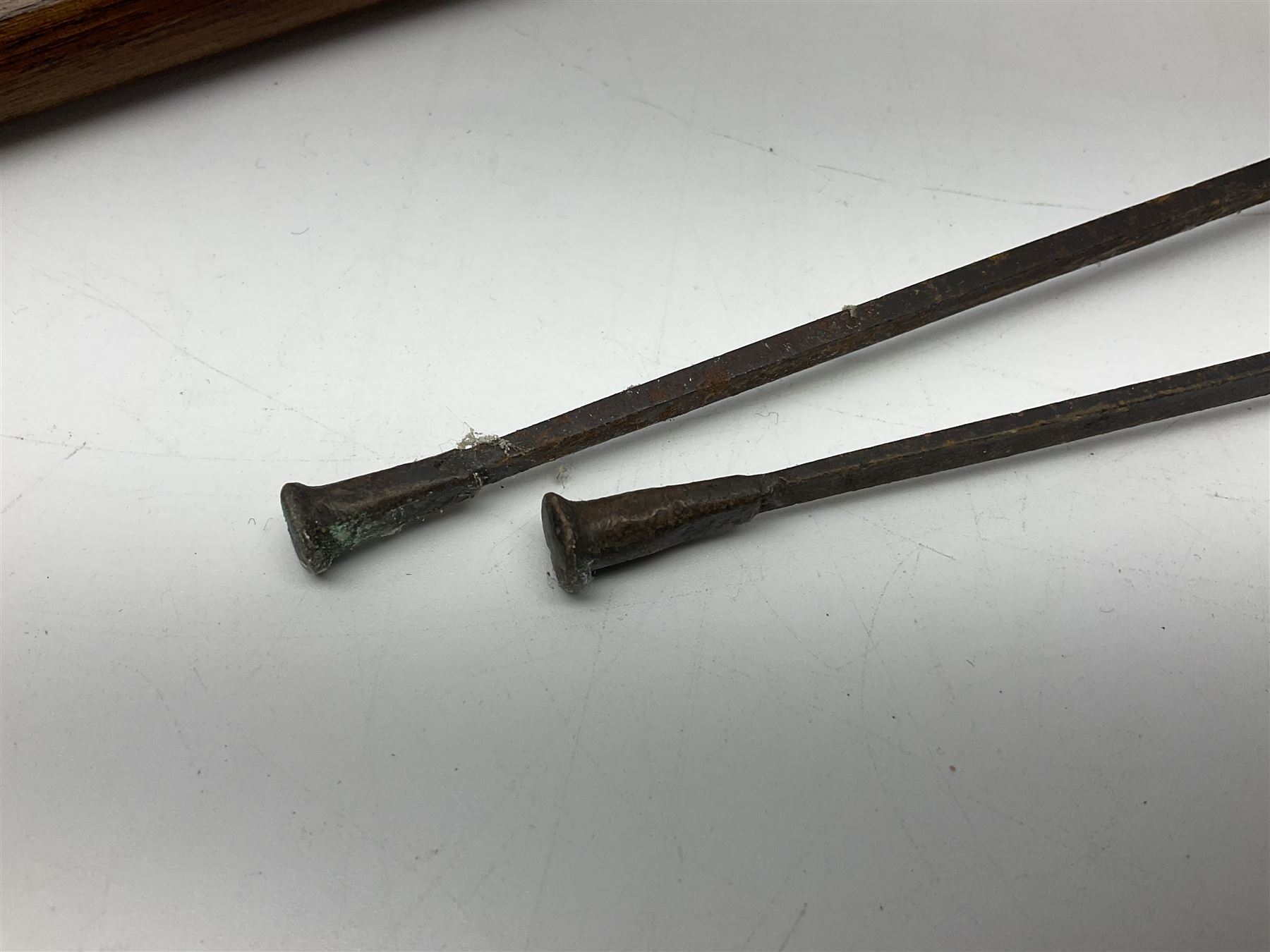 Leather covered swagger/sword stick with 40cm steel blade L62cm overall; another ash sword stick with 30cm diamond section steel blade; pair of fencing foils, the blades marked Solingen; two reproduction flintlock pistols; and 92cm inert cartridge belt (7)