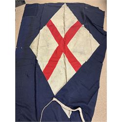 Ship's house flag, rectangular linen flag, with a white diamond and red cross to the centre, upon a cobalt blue ground, inscribed on the hoist 'Cutty Sark', H130cm, W170cm

Provenance by vendor repute: Vendor's father was a naval cadet in 1940s/50s on board HMS Worcester which was moored alongside the Cutty Sark on the River Thames at Greenhithe. He has had the flag since then. 