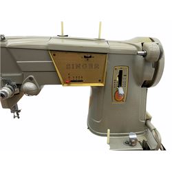 Singer electric sewing machine in teak worktable