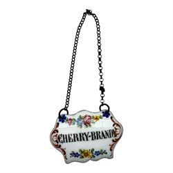 Seventeen mid 18th century and later enamel wine labels, one example of heart shaped form, the rest of cartouche and escutcheon form, various titles including Claret, Rum, Sloe Gin, Port, Whisky, Cowslip, Cherry-Brandy, etc., largest example W7cm 