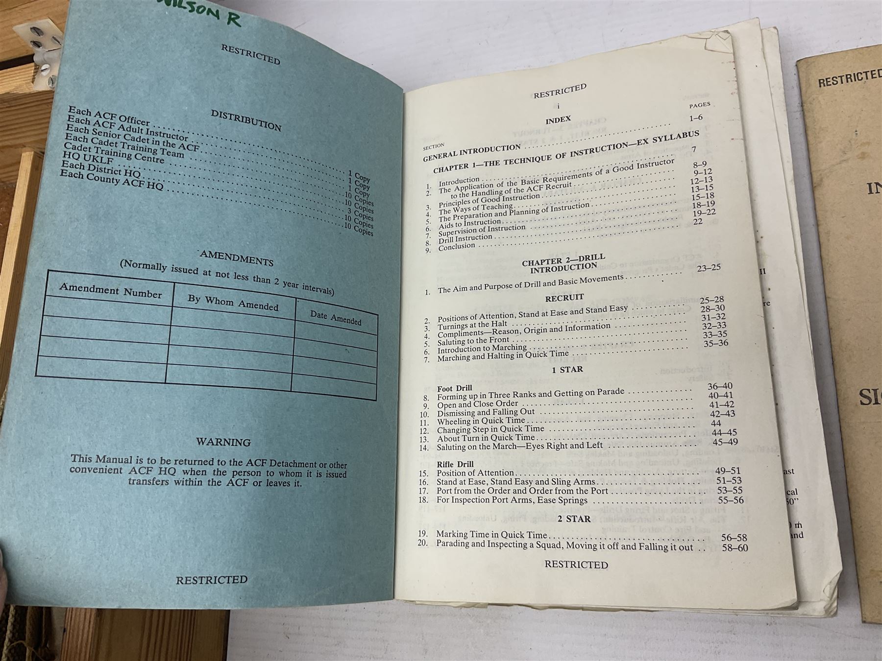 Collection of nineteen British Army booklets 1940s - 1970s including Small Arms Training 1944, various Infantry Training, Cadet Training Manual 1978, Signal Training, Commander's Aide Memoires etc; 1950s blue beret with Yorks Brigade badge; part travelling toilet set in cloth roll; all contained in pine box with webbing straps