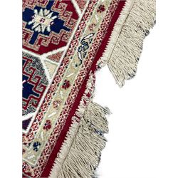 Bakhtiari design rug, the field divided into panels each decorated with tree of life and floral motifs, the main border decorated with Hac motifs 
