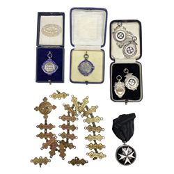 Four St John's silver fobs, together with two silver Directors Ambulance shield fobs and two other St Johns items 