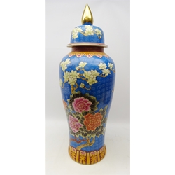  20th century Chinese ceramic floor vase and cover, inverted baluster form decorated with flowers on blue ground, H92cm   
