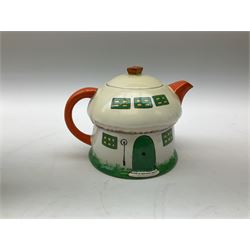 Shelley Boo Boo three piece tea set designed by Mabel Lucie Attwell, comprising teapot modelled as a house, sugar bowl modelled as a toadstool, and creamer modelled as an elf, each with printed marks beneath, together with a Shelley Mabel Lucie Attwell teacup and saucer. 