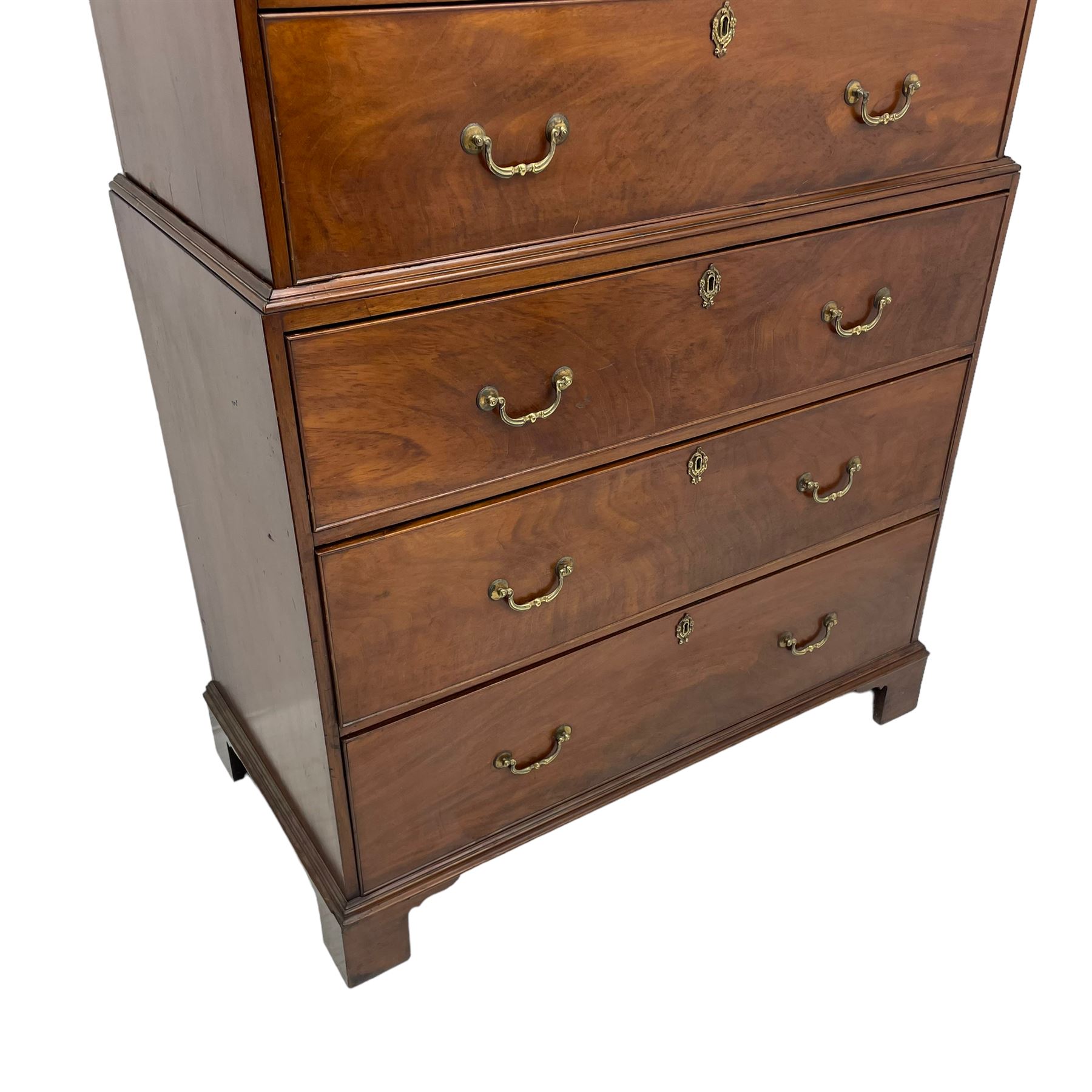 George III figured mahogany chest-on-chest, projecting moulded cornice over two short and six long graduating cock-beaded drawers, on bracket feet
