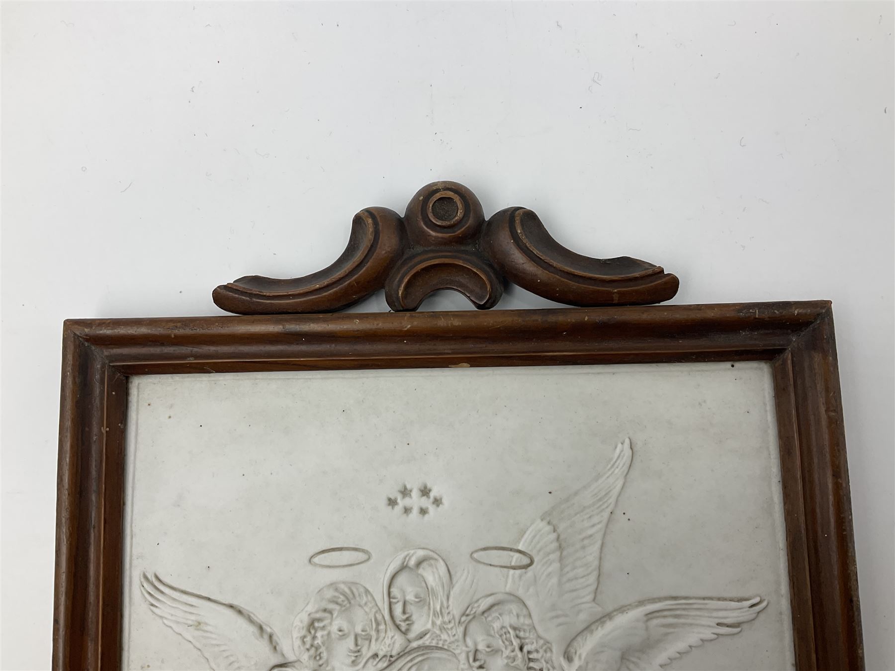 KPM Berlin lithophane panel, of two angels supporting a female figure to the centre, encased in a rosewood frame and handle, H42cm