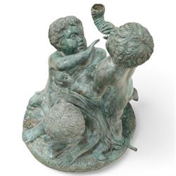 Cast bronze garden water fountain in the form of three Putti on circular naturalistic base, stamped 'Leonardo Rossi'  