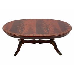 Late 20th century oval mahogany coffee table, on twin pedestal base