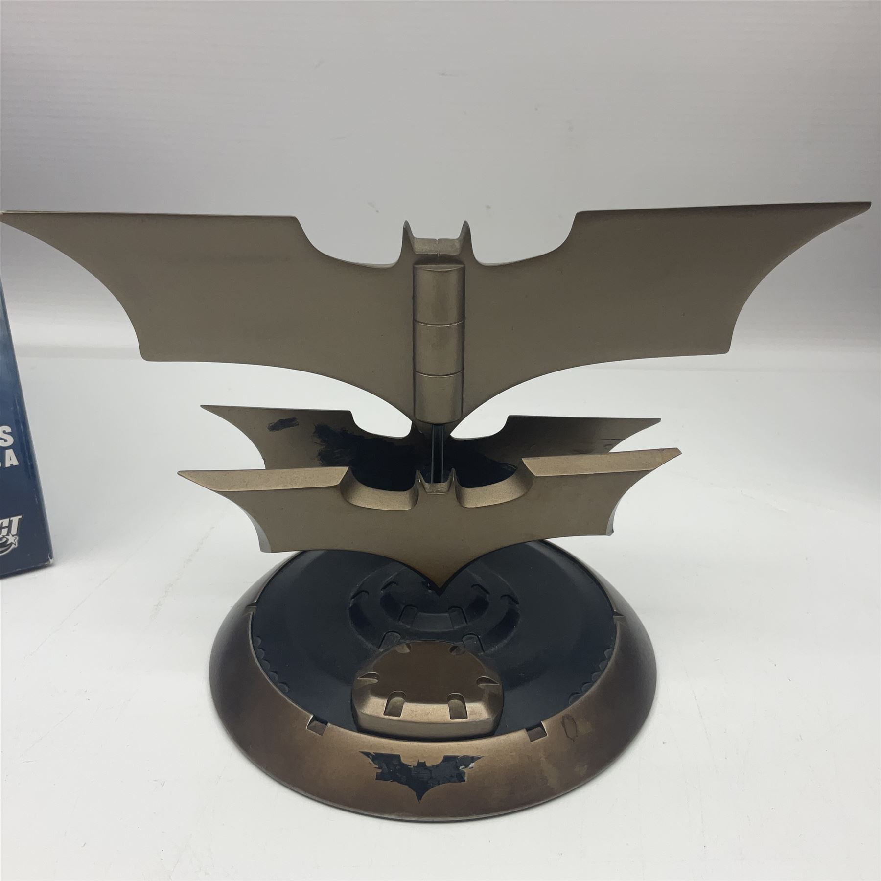 Two Batman replica Batarangs comprising DC Comics QMX Caliber Metalworks 1:1 scale replica with original box, and DC Direct The Dark Knight prop replica no. 33/1500 with original box and certificate of authenticity 