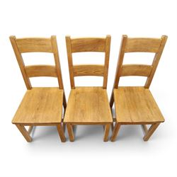 Indigo Furniture - large rustic oak dining table, rectangular four plank top raised on square supports; with set of six beech high ladder-back dining chairs