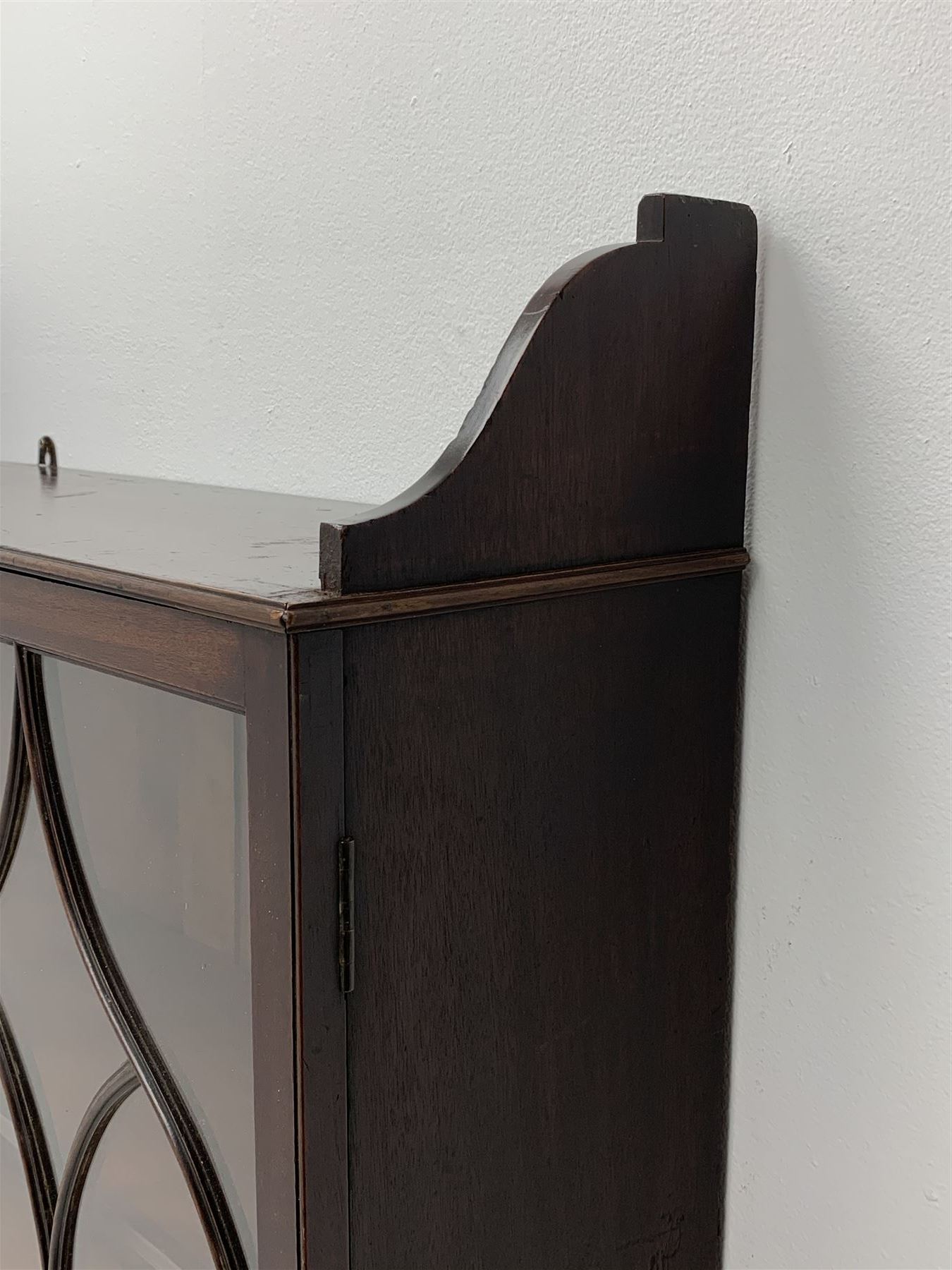 Georgian mahogany Gothic wall hanging cabinet, enclosed by two ogee pointed arch astragal glazed doors, plain sides with shaped top and bottom brackets