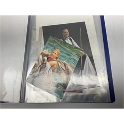 Two folders of over fifty photographs, cards, compliment slips etc of actors, actresses, celebrities, politicians, sports personalities etc, all bearing signatures, including David Frost, Lloyd Grosman, John Suchet, Julia Somerville and othe GMTV presenters, Carol Vorderman, Jackie Collins, Rolf Harris, Timothy Dalton, Pete Postlethwaite, Magnus magnusson, John Major, Kate Moss, Uri Geller, David Beckham, Peter Alliss, Sharon Davies, Kevin Keegan etc