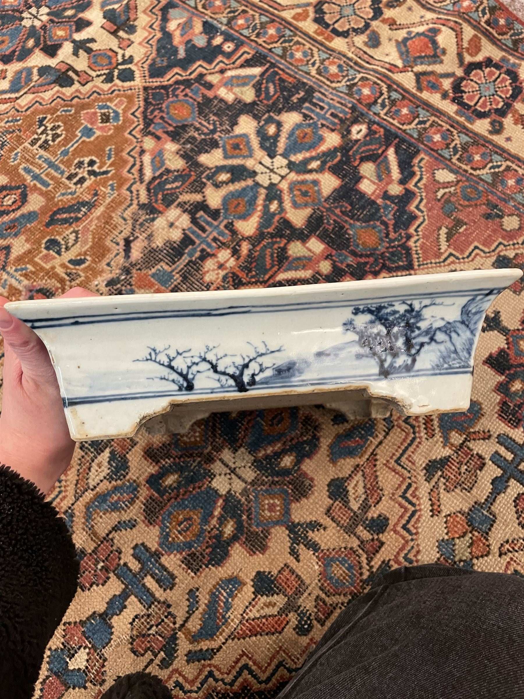 19th century Chinese blue and white planter and stand, each of square slightly tapering and flared form, the planter decorated with figures and precious objects between stylised foliate borders, the stand decorated with landscapes beneath a lipped rim with cell band, planter H28cm D25.5cm, stand H7cm D26cm