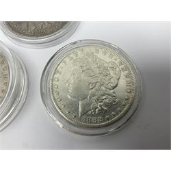 Three United States of America silver Morgan dollar coins dated 1881 O, 1882 and 1882 O