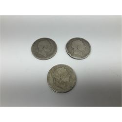 Eleven Great British crown coins, three King George III all with heavily rubbed dates, seven Queen Victoria dated four 1889, 1891, two 1896 and a King Edward VII 1902 crown