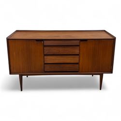 Richard Hornby for Fyne Ladye - mid-20th century afromosia teak sideboard, retailed by Heals of London, rectangular form, with low profile carved gallery lip, above three central drawers with ribbed drawer fronts, flanked by two cupboards with vertically grained doors and recessed pull handles, with streamlined moulded edges and sides, raised on tapered slender legs 