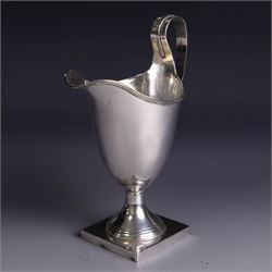 Edwardian silver helmet shaped cream jug, upon a square base, hallmarked John Rose, Birmingham 1905, together with a 1930s silver christening mug with engraved initials to body, hallmarked Aaron Lufkin Dennison, Birmingham 1936, jug including handle H13cm