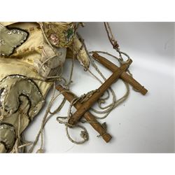 Large string puppet, probably Thai or Burmese, modelled as a woman in traditional costume embellished with sequins, the painted head with articulated mouth, the wood body and hands jointed, L70cm