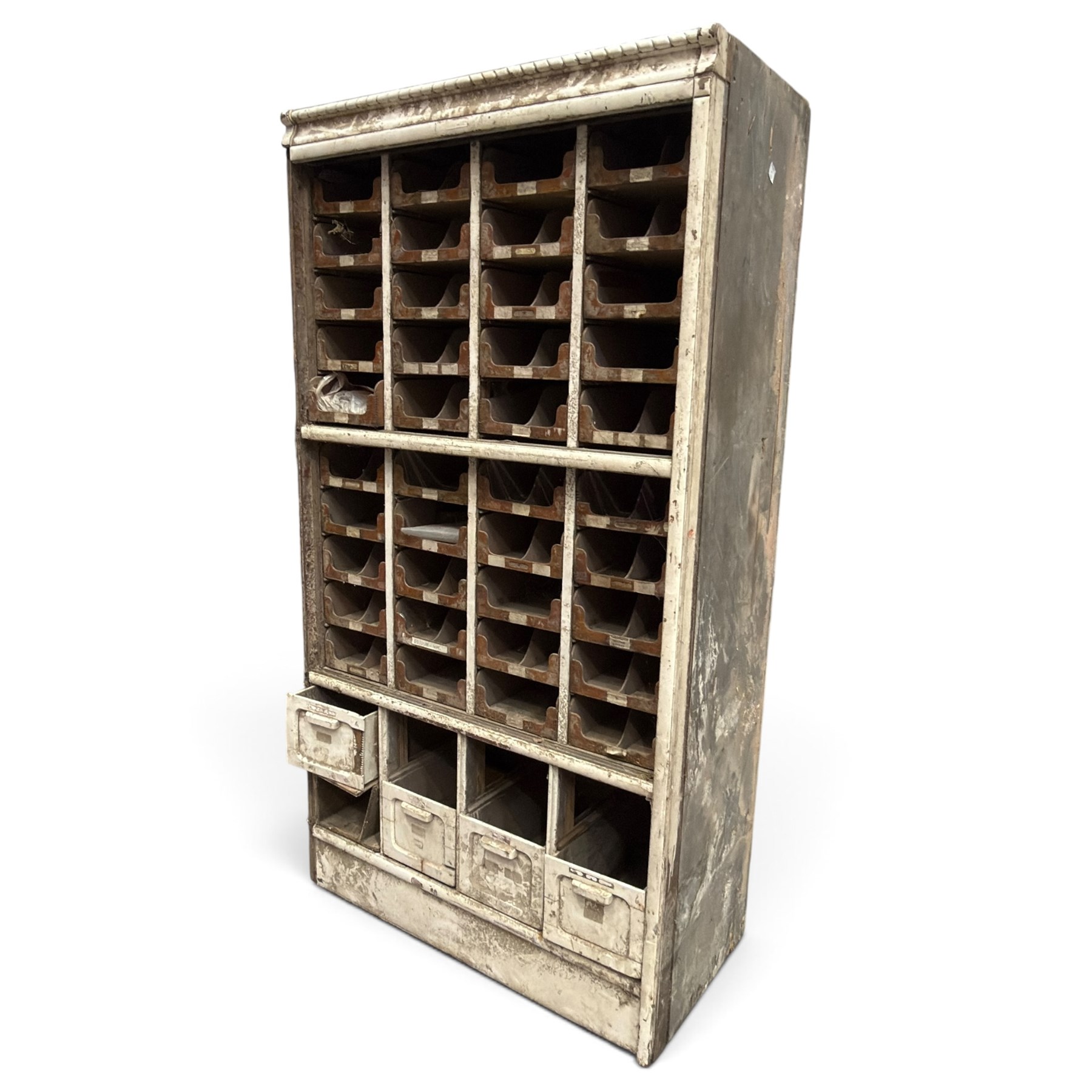 F Pollard & Co - late 19th century rustic haberdashery shop cabinet, fitted with an assortment of forty sliding trays, with drawers fitted to base, in antique white-painted finish