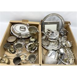 Group of metal ware, largely comprising silver plate, to include tea wares, toast racks, entree dish and cover, pair of candlesticks, tankards, napkin rings, teaspoons, etc., in two boxes 