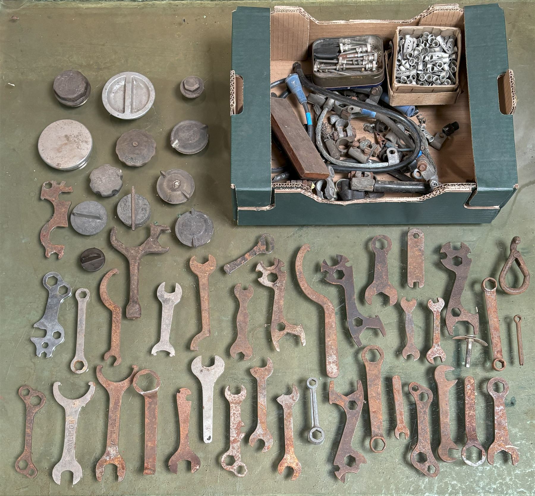 Collection of vintage bicycle spanners, car battery terminals, fittings, radiator caps etc, together with three vintage sportscar windscreen frames - COLLECTION BY APPOINTMENT FROM: The White House, Thirsk Road, Easingwold, York, YO61 3NF - CALL 01723 507111 TO ARRANGE