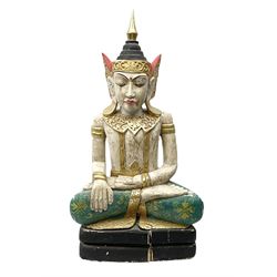 Large painted carved wood figure of a seated Buddha in typical pose, decorated with gilding throughout, upon raised plinth, H74cm