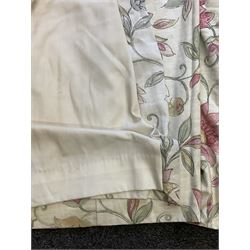 Pair lined curtains, in pale ground fabric with scrolling design decorated with flowers in pink, pleated headers, width at header -150cm, fall - 200cm