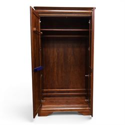 Willis & Gambier - mahogany bedroom wardrobe, projecting cornice with two additional rails, panelled doors with trouser rack and blue baize trinket, enclosing a shelf above a wooden clothes rail and shoe rack, raised on bracket feet 