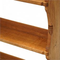 Gnomeman - oak plate rack, rectangular moulded top over three open plate shelves with raised front rails, shaped and chamfered upright supports, stepped base plinth, signature carved Gnome by Thomas Whittaker of Littlebeck