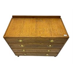 Mid-20th century oak chest, raised back, fitted with four graduating drawers, on castors