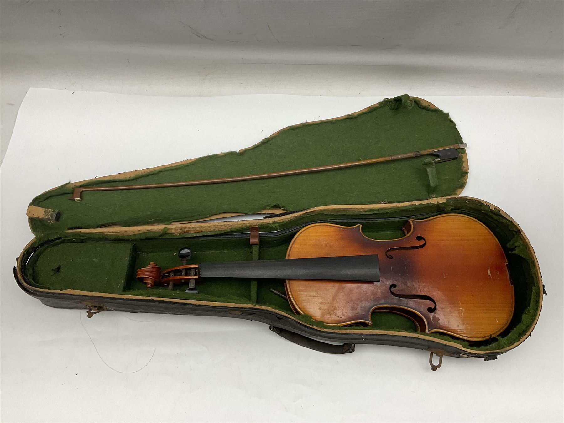 Czechoslovakian violin c1920 with 36cm two-piece maple back and ribs and spruce top, bears label 'Copy of Antonius Stradivarius Made in Czechoslovakia' L59cm; in carrying case; 1950s Czechoslovakian violin; and 195os Czechoslovakian three-quarter size violin; both cased (3)