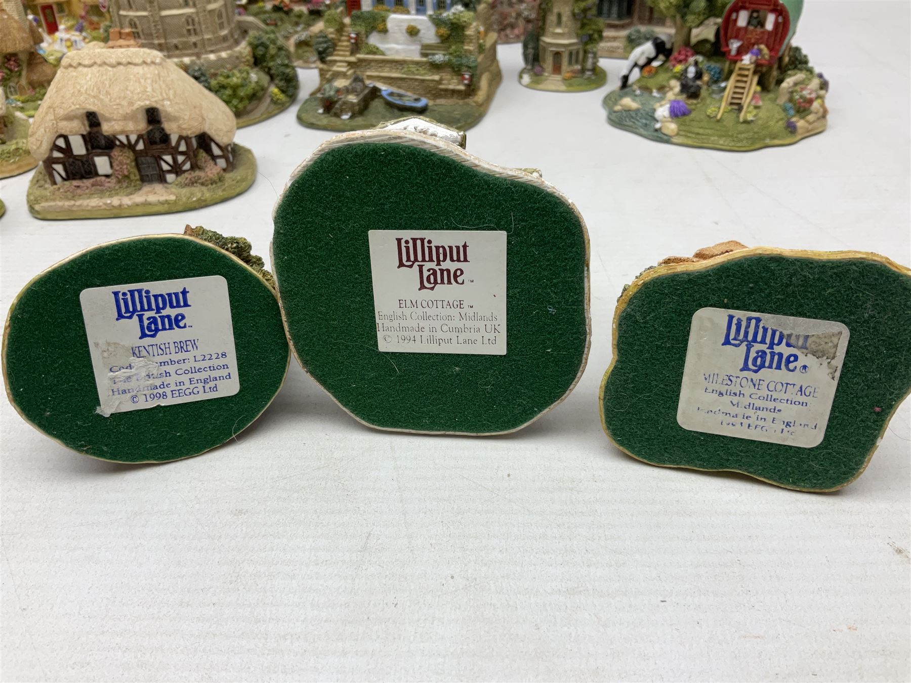 Sixteen Lilliput Lanes, to include The Golden Jubilee, Round Tower - Windsor Castle, Castle of the Golden Chalice, Travellers Rest, with box and deed,  Summer Days, Sunshine Creek, Writing with Lewis Carol, with box and deed,  etc 