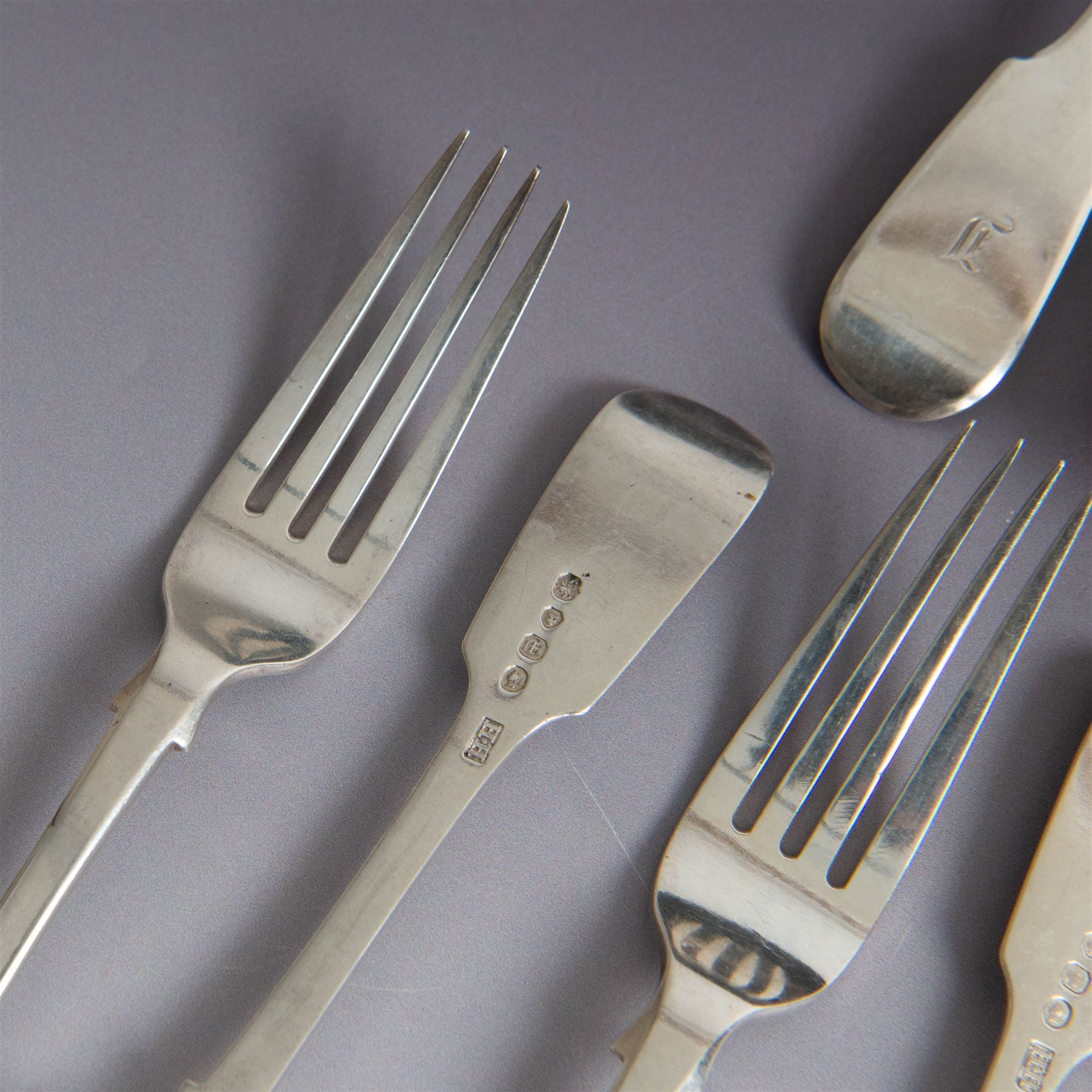 Set of Victorian silver Fiddle pattern cutlery for six place settings, comprising two table spoons, six dessert spoons, six table forks and six dessert forks, all engraved with initial to terminal, table spoons and dessert spoons hallmarked Robert Williams & Sons, Exeter 1848, forks hallmarked Henry Holland, London 1847