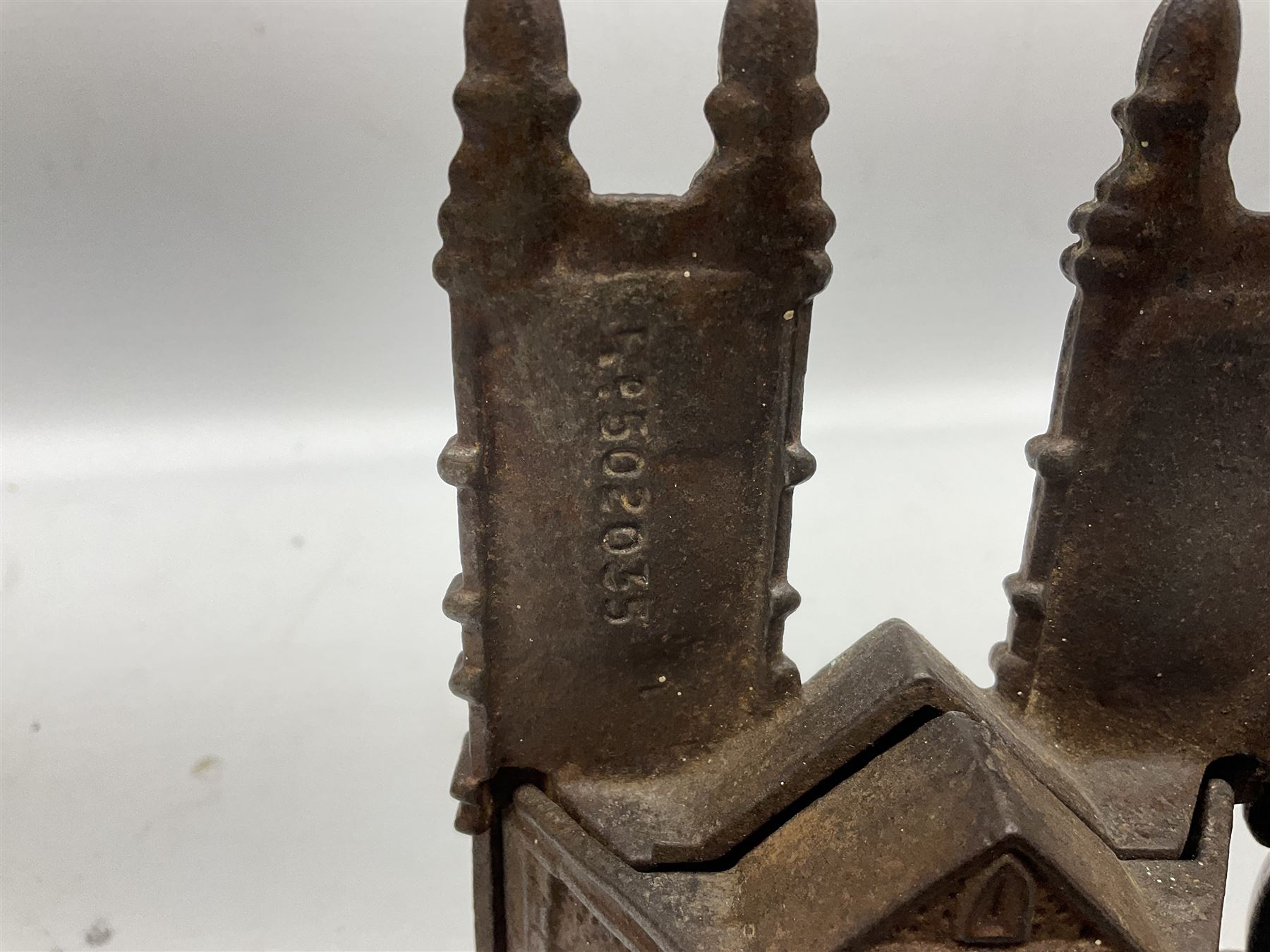 Four cast-iron money banks - 'Bear On Hind Legs bank' c1906 H16cm; 'ERII English Throne Bank' 1953 H21cm; both made by John Harper; 'Tally-Ho Bank' c1906 by Chamberlain & Hill H11.5cm; and 'Westminster Abbey Bank' c1908 by Sydenham & McCoustra H16cm (4)