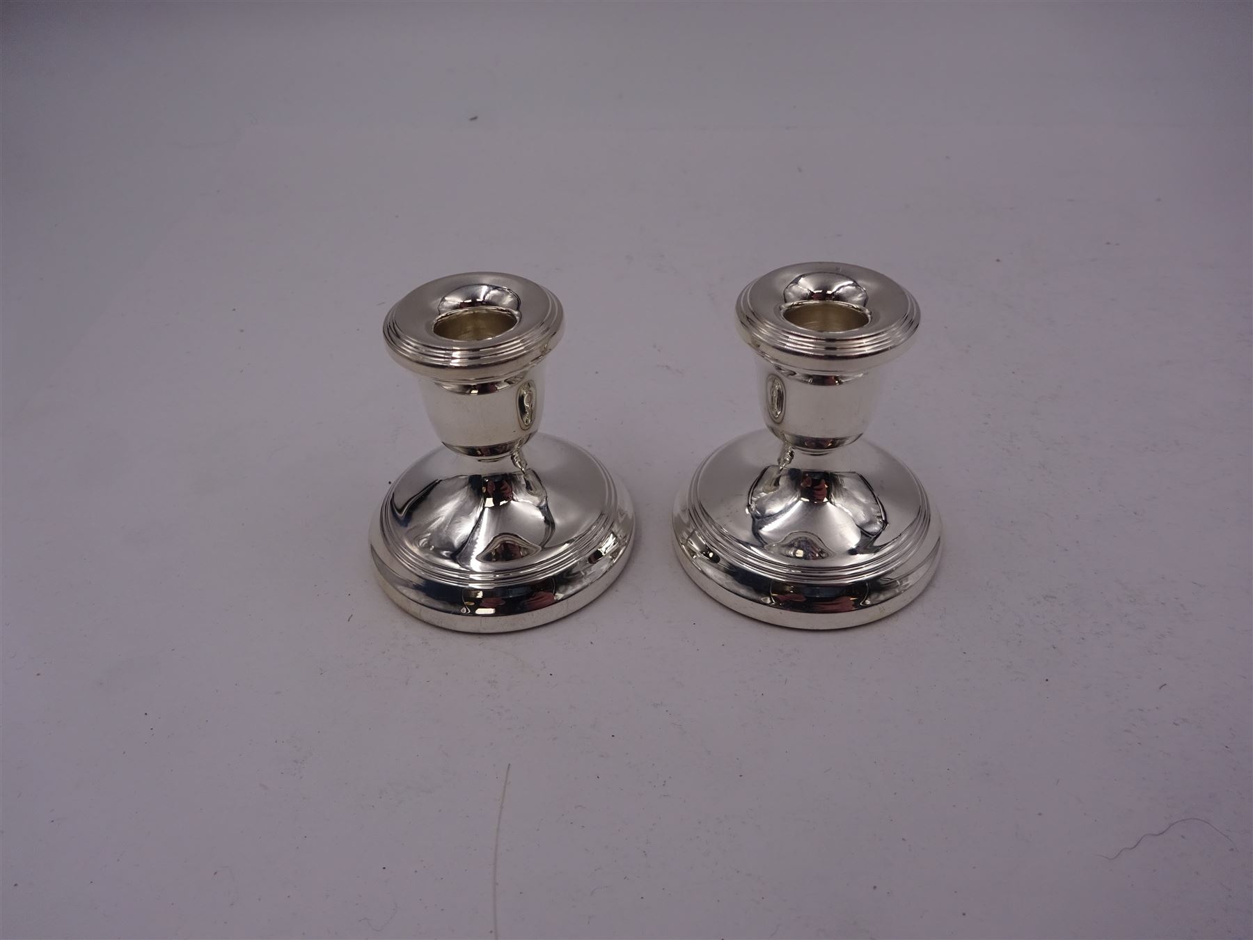Pair of modern silver miniature candlesticks, hallmarked L R