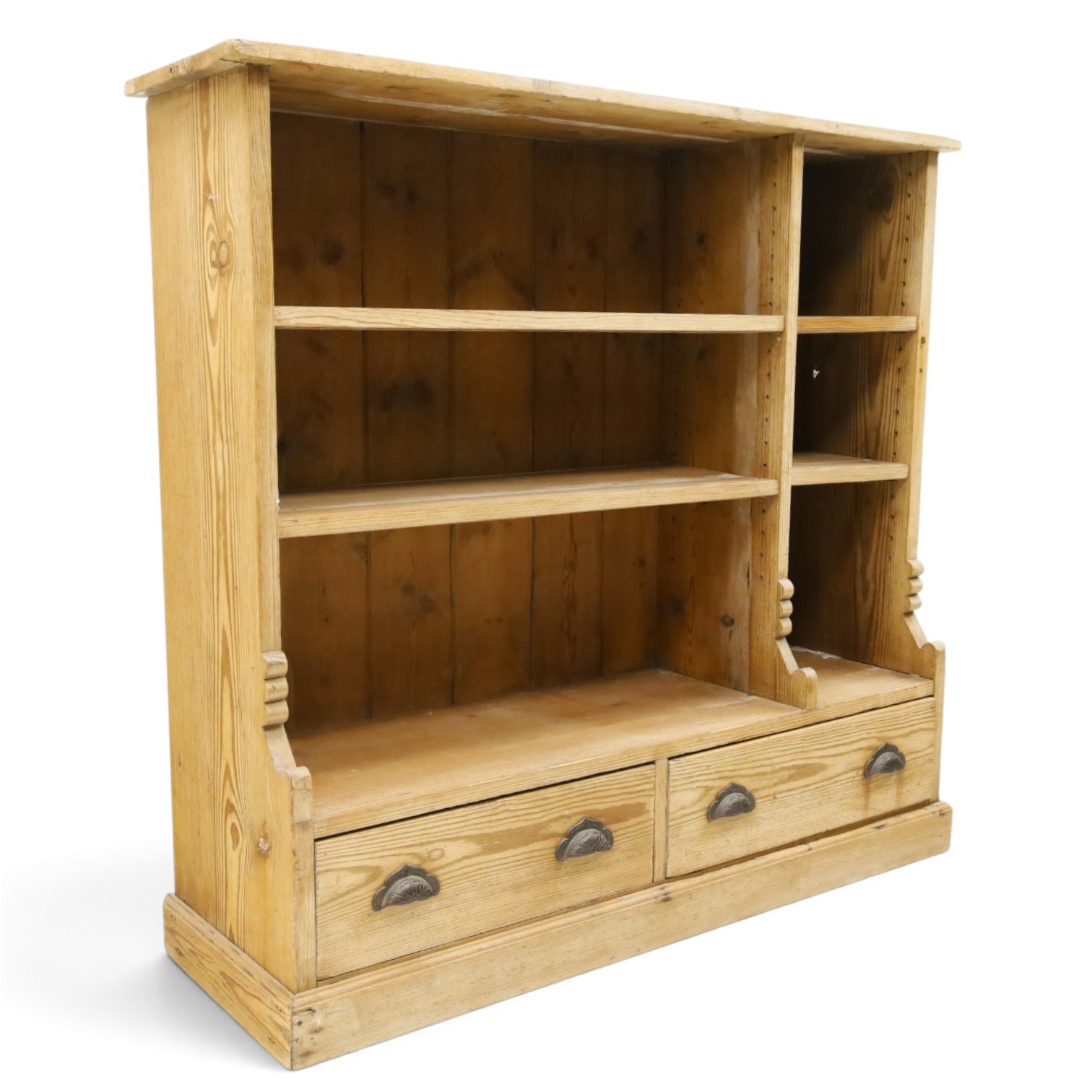 Late Victorian stripped pitch pine open bookcase, fitted with four adjustable open shelves, two drawers fitted to base with pull handles, on skirted base 