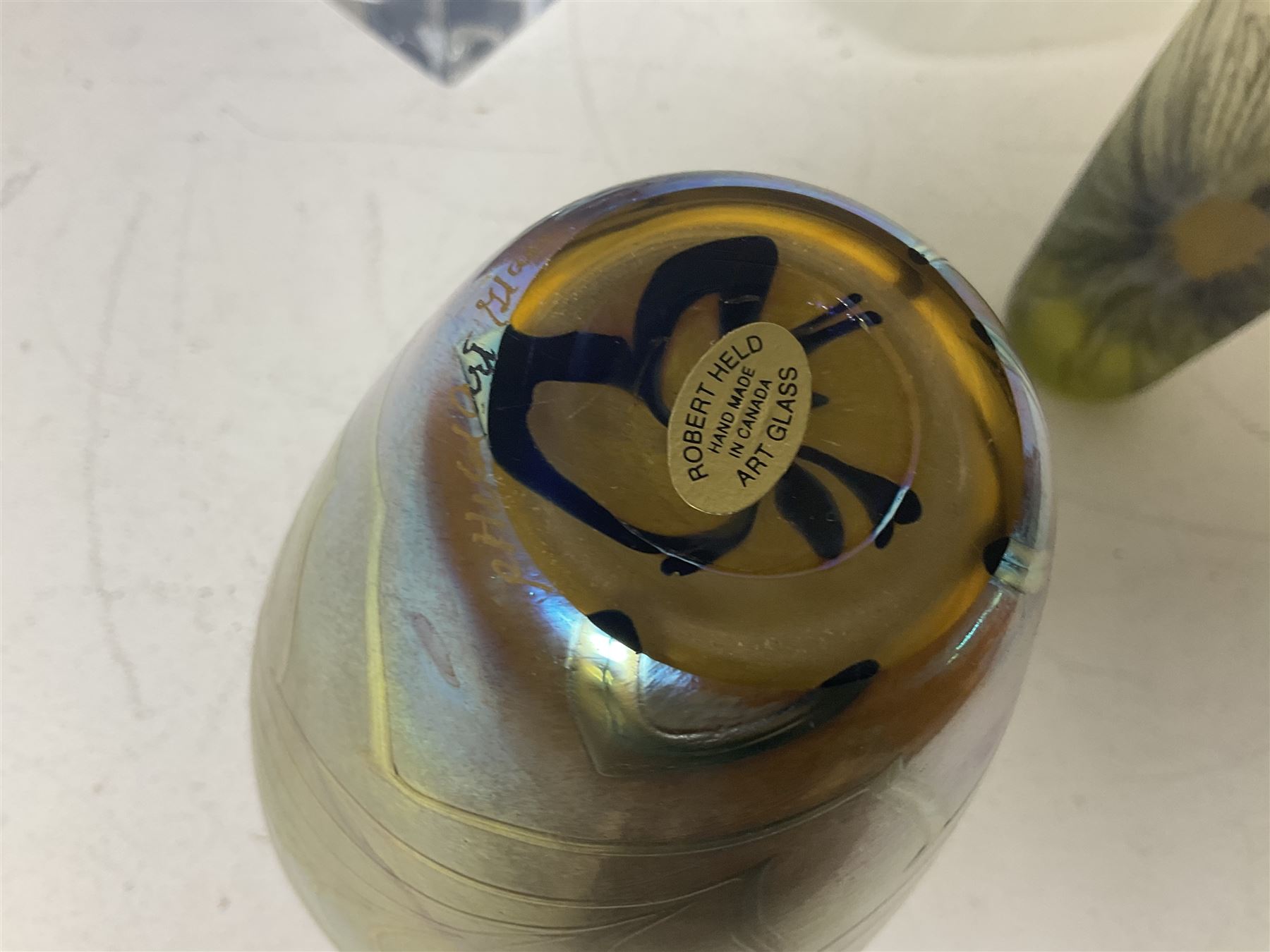 Late 20th century art glass, to include a Robert Held vase, of baluster form with iridescent swirl design, two frosted glass vases with peacock feather design on green and white ground, frosted glass tulip shaped bowl with smoke design and a Rogaska Crystal cobra candlestick, tallest vase 27cm