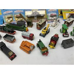 Ertl Thomas the Tank Engine and Friends die-cast models including carded Scrap Trevor, Slate Trucks, Neil, Wilbert, Sodor Taxi, Sodor Recovery Unit, Crane and four key rings; together with various uncarded models including locomotives, coal wagons, steam rollers, boat transporter, recovery units etc (over forty items)
